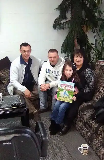 David Haave with soldiers and families at Mrs Kims barbershop St Robert MO -- David Haave